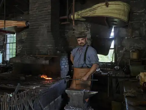 Blacksmith at the anvil at Old Sturbridge Village, Massachusetts