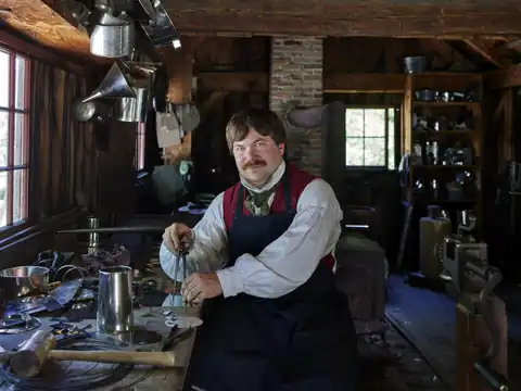 Tinsmith at work at Old Sturbridge Village, Massachusetts