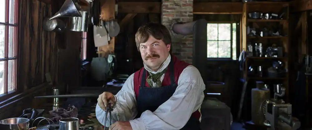 Tinsmith at work at Old Sturbridge Village, Massachusetts